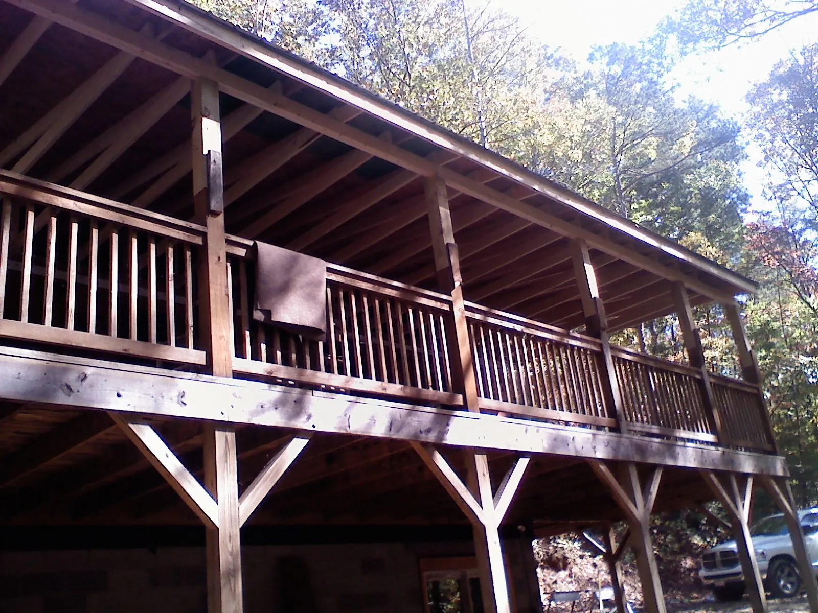 Timber framing under a new elevated porch and deck — Roof Leak Repair in Andale by Roofing Brothers